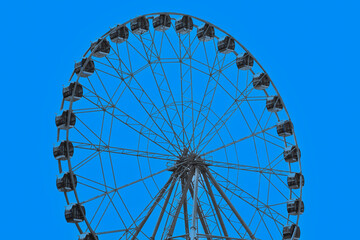 A fragment of the Ferris wheel at an amusement park on a summer day © vladimir subbotin
