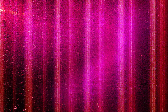 Red pink glitter paper texture background with space. glitter star effect just like space. night sky universe rusty texture rough grain.