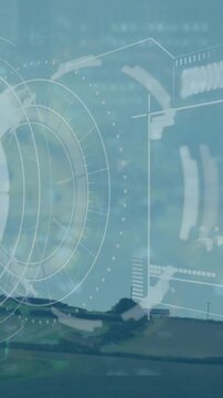 Animation of sonar with loading bars and graph over windmill and landscape against sky