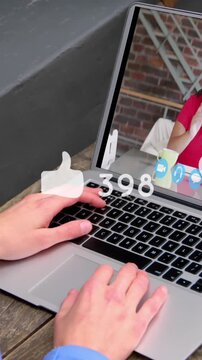Animation of social media icon and numbers over caucasian businesswoman using laptop