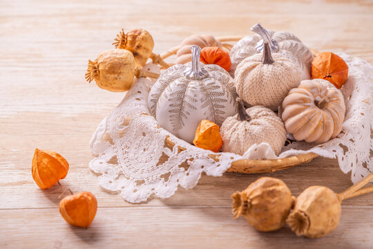 Autumn harvest of pumpkins and gourds arranged on a rustic wooden table