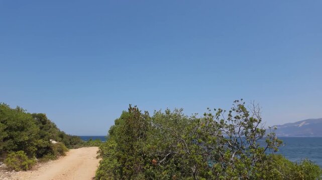 Walking towards a beach on Karaburun peninsula with blue and turquoise waters