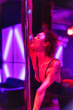 Expressive dance in vibrant lighting.