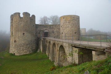 Fototapeta premium The ancient Koporye fortress on a foggy October morning. Leningrad oblast, Russia