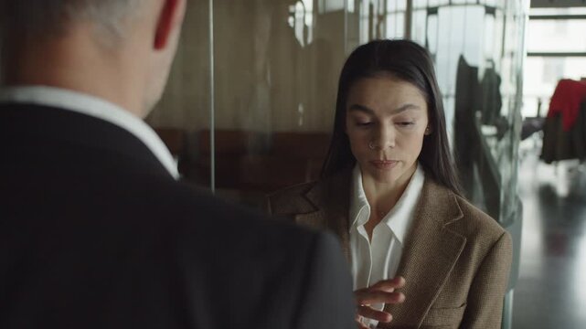 Millennial business colleague walk at office. Cooperation for success. Coworker office colleague. Boss and employee. Colleague expert. Businesspeople together meeting in office, selective focus