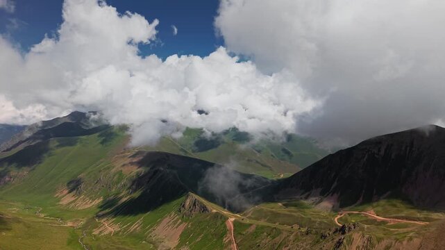 Timelapse of Cumulus Clouds Drifting Over Mountain Range