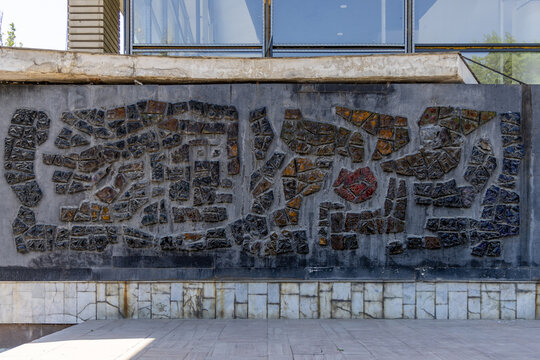 Textured Abstract Mosaic Mural on Concrete Wall