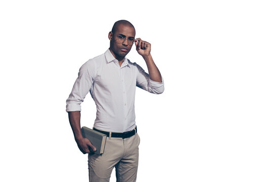 Close up photo amazing stunning dark skin he him his macho arms hands hold paper planner organizer not smiling office read reader shaved face wear specs white shirt isolated grey background