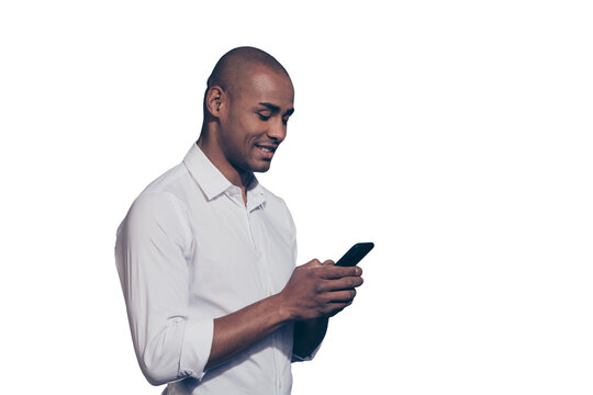 Close up side profile photo amazing dark skin he him his macho perfect appearance hold hands arms telephone smart phone reader writing corporate currency wear white shirt isolated grey background
