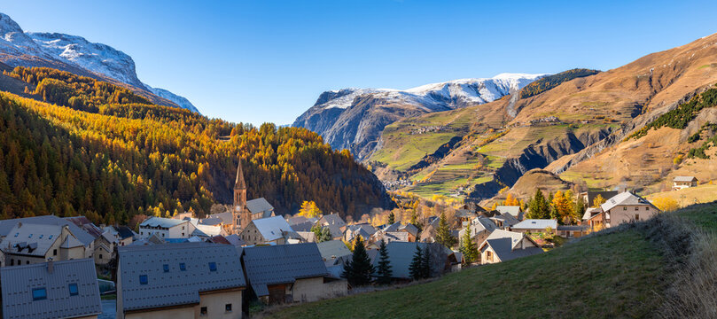 Autumn view of Villar-d'Arene with the villages of Les Terrasses, Ventelon and La Grave in the distance. Romanche Valley, Ecrins National Park, Hautes-Alpes, France