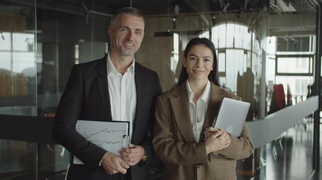 Businesspeople successful portrait. Millennial and mature business colleague leadership. Cooperation for success. Coworker office colleague. Boss and employee. Colleague expert