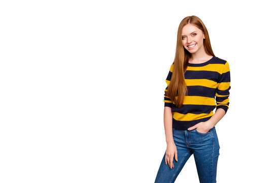 Portrait of pretty cute lovely charming stunning fit slim slender gorgeous confident wearing yellow and black striped pullover tight jeans keeping hands pocket isolated on gray background copy-space