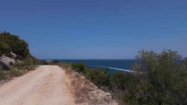Walking on Karaburun peninsula looking at Vlora bay and Zvernec in the distance