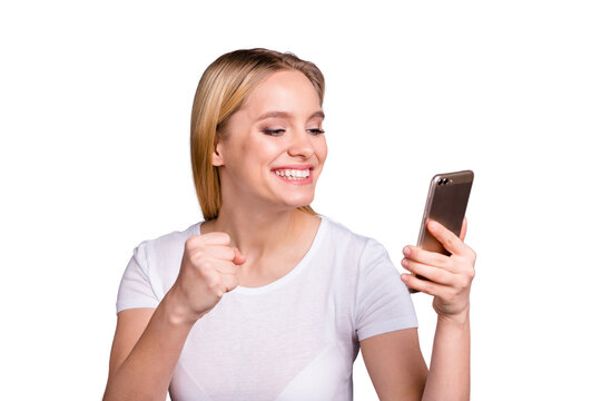 Portrait cheerful cute charming lady hold hand modern technology device scream shout yeah achieve aim luck lucky fortune sport match thrilled dressed modern youth clothing isolated grey background