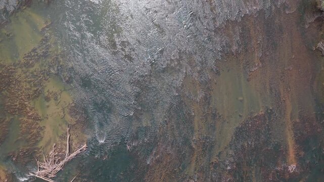 Top down view over shallow, rocky stream