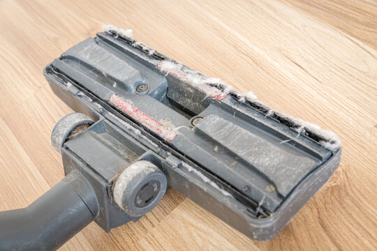 Dirty vacuum cleaner brush with dust. Cleaning concept