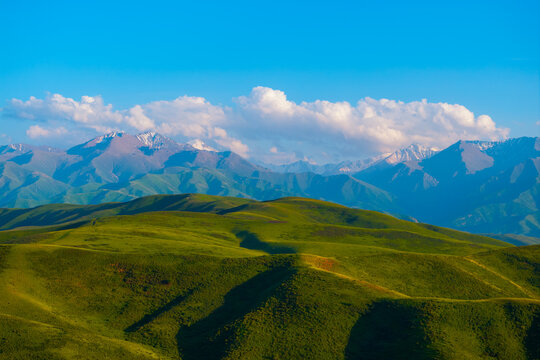 Rolling Green Hills and Snow-Capped Mountains in Kyrgyzstan