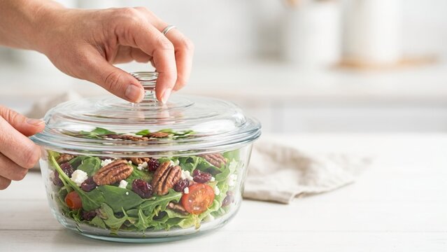 Fresh Healthy Salad In A Glass Bowl With A Lid In The Kitchen