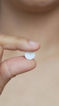 close up  hand holding a medicine. Stop drug use Taking Medication Caring for the health care medical concept.