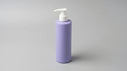 Purple cosmetic pump bottle standing upright with a white dispenser nozzle © ChaohM