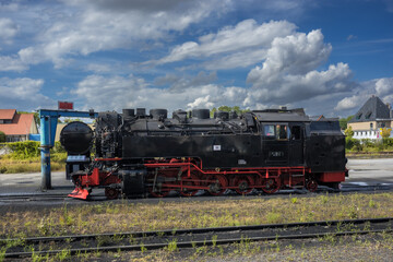 Historic Black and Red Steam Locomotive on Tracks at Harz Railway Depot © LeonHansenPhoto
