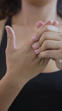 Closeup women holds his wrist. hand injury, feeling pain. Health care and medical concept. and those with a family history of degenerative knuckles.
