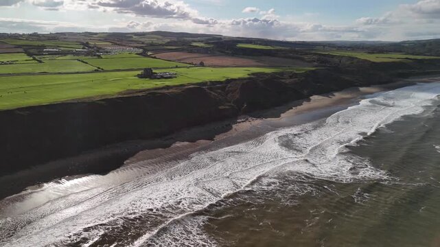 Aerial Panoramic View of Yorkshire Coastline Cliffs Beach and Patchwork Farmland in England