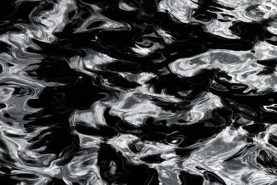 Swirling, abstract black and white fluid motion, light reflections