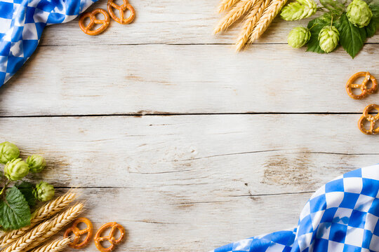 beer festival table background with pretzels hops and wheat