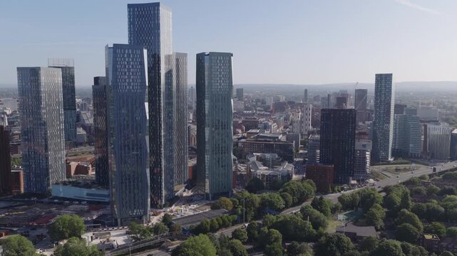 Establishing aerial view of Manchester, United Kingdom. Modern skyline of sprawling metropolis in the North of England