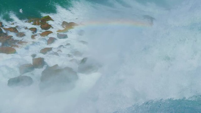 Cinematic Slow Motion High-Angle Shot of Niagara Falls Crashing on Rocks with Mist Rainbow in 4K 120fps