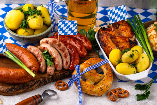 Oktoberfest food: beer brezel sausages cabbage potato and chicken