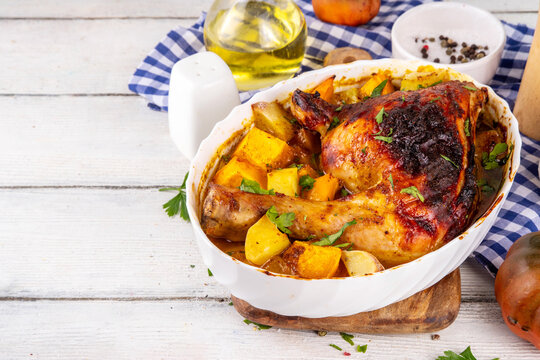 Roasted baked chicken quarter with pumpkin and potato stew