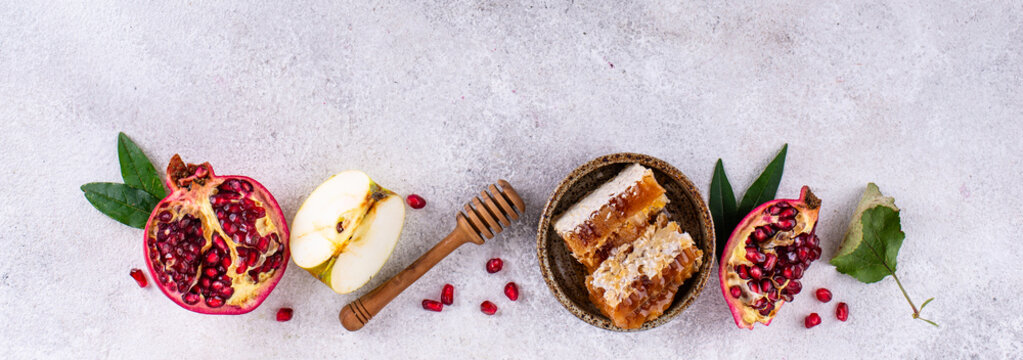 Rosh Hashana Jewish New Year concept with honey apple and pomegranate