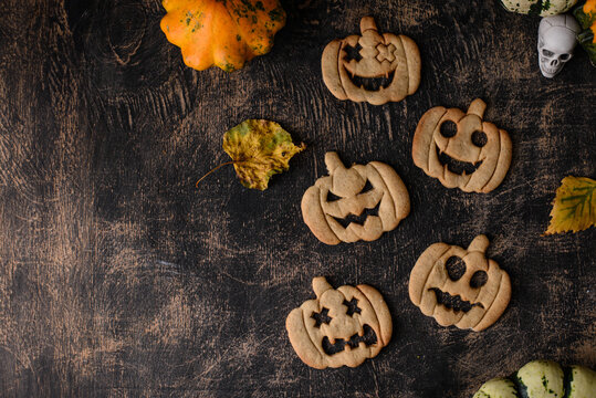 Halloween pumpkin cookies in shape of jack-o-lantern
