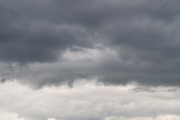 Obraz premium Dramatic clouds gather ominously over the landscape hinting at an impending storm