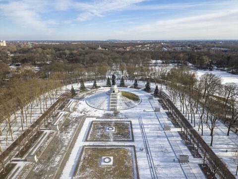 Aerial view of the Soviet War Memorial in Tiergarten surrounded by snow-covered parkland and bare trees in Berlin, Berlin, Germany.