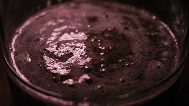 Boiling emulsion from overheating lamp in magenta tones, a decay grunge film burn suited for video editing multimedia projects