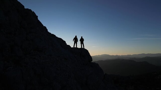 Determined Alpinists Struggling to Reach the Summit on a Dangerous High-Altitude Climb over Clouds