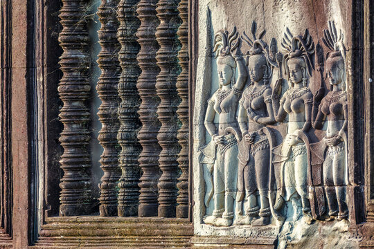 Apsara dancers stone carvings details in Angkor Wat temple, Siem Reap, Cambodia