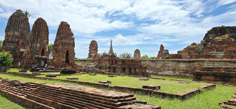 The prang (tower) and its foundation are constructed of brick. Prang is shaped like corncob. Red bricks in front are foundations of former vihara (temple) or church.  Ayutthaya Historical Park, Ayutth