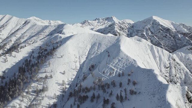 Aerial video footage above Orobie mountains after snowfall, Lombardy landscape, Italy