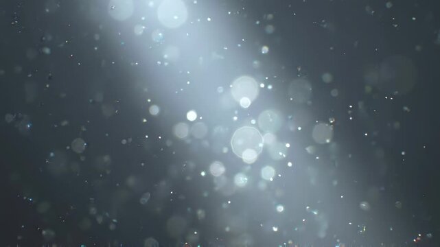 Ethereal glowing dust specks in slate and gray tones, atmospheric dust bringing ambiance energy to advertising design work