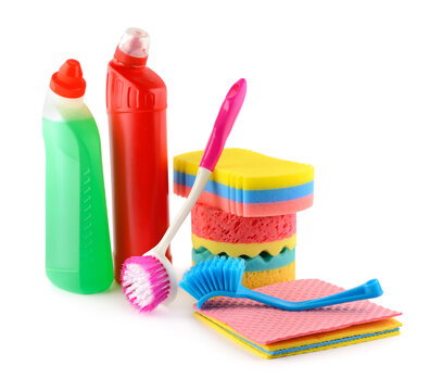 Assorted Housekeeping Supplies with Detergent Bottles, Sponges, Brushes, and Rags Isolated on White