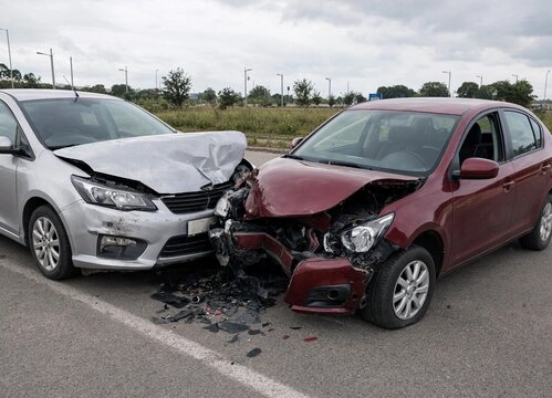 Two cars involved in front end collision accident scene