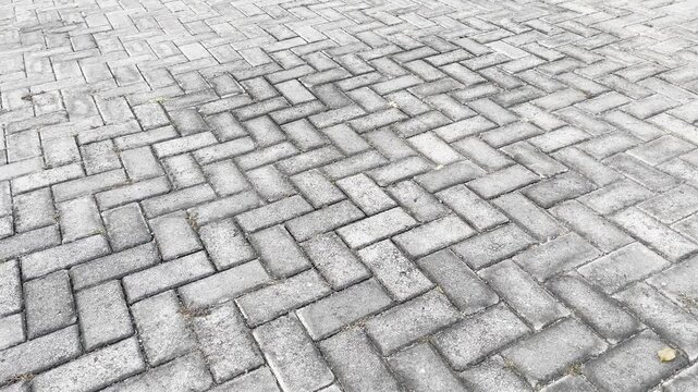 High angle view of herringbone interlocking paving blocks texture
