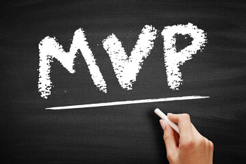 Naklejka premium MVP stands for Most Valuable Player, an honor typically bestowed upon the best-performing player in a sports league or game, written in chalk on a dark chalkboard surface