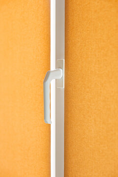 Plastic door handle detail close up, modern white pvc frame lock mechanism for home security concept