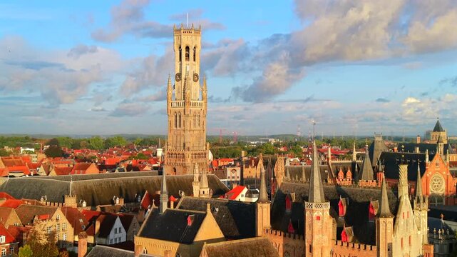 Aerial view of Bruges city with rooftop buildings during  sunrise Belgium