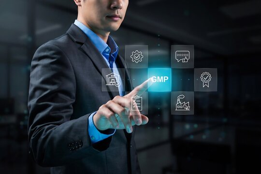 Businessman pressing glowing blue gmp hologram icon for quality control and compliance